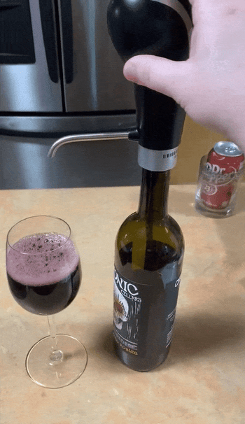 GIF of reviewer pouring red wine out of aerator 