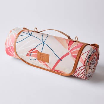 rolled up graphic print picnic blanket