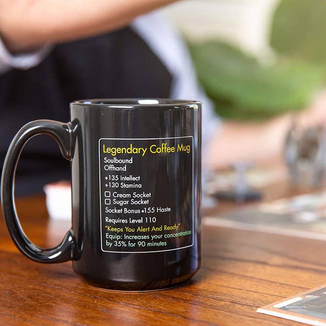 a black coffee mug with fake world of warcraft stats about coffee