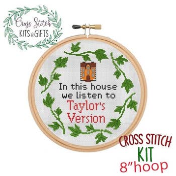 a cross stitch hoop that says in this house we listen to taylor's version