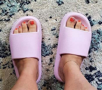 reviewer wearing the lavender sandals