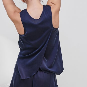 back view of model wearing the set in blue showing tulip detailing