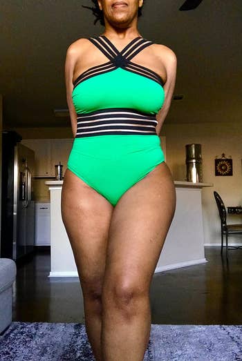 reviewer in the bathing suit in green