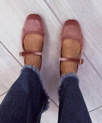 Woman wearing stylish square-toed Mary Jane shoes with frayed hem jeans for a fashionable casual look