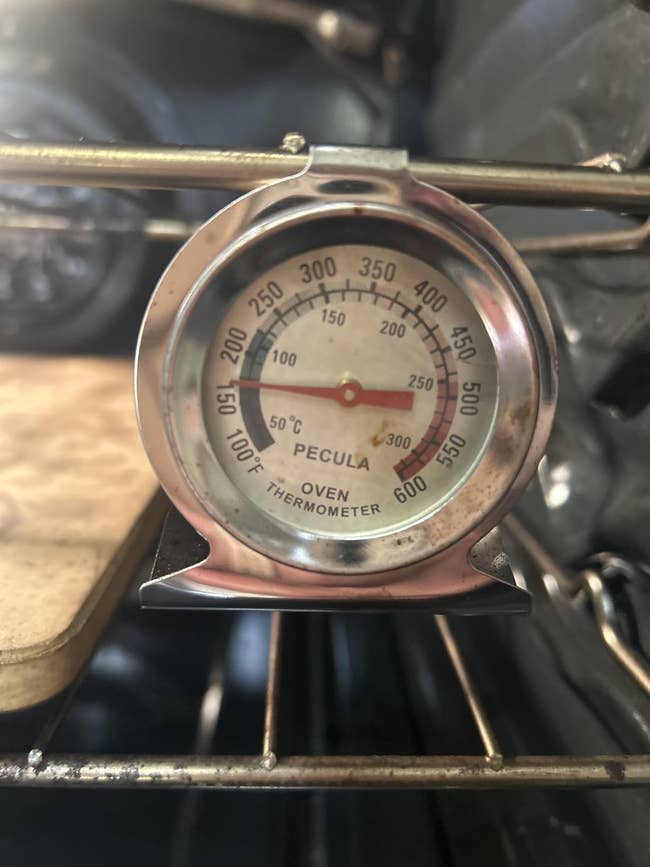 Oven thermometer showing somesthesia astatine 250 degrees Fahrenheit wrong an oven