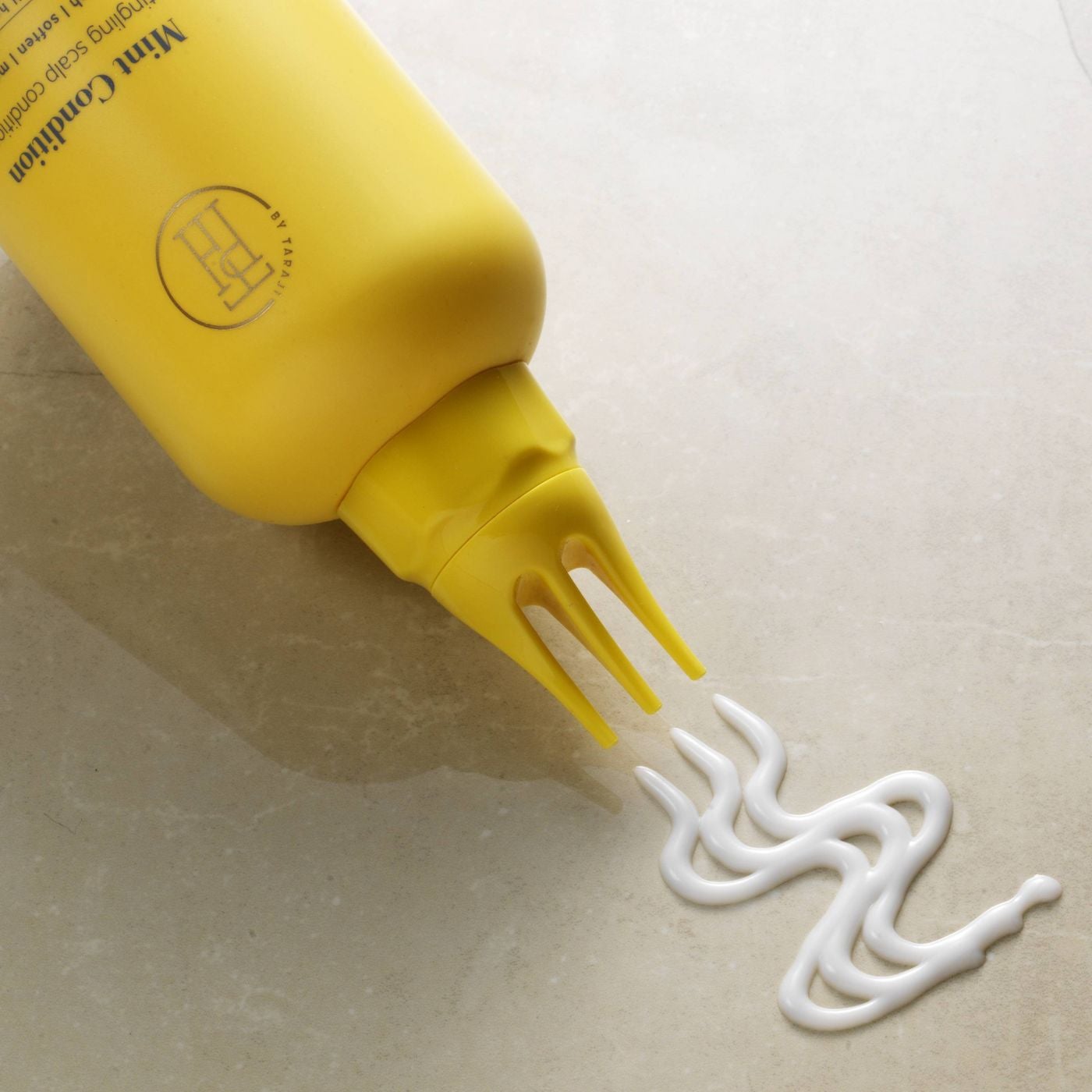 the yellow bottle of conditioner