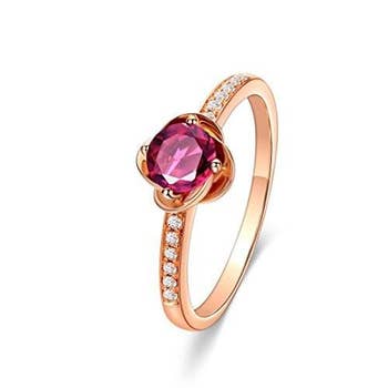 a closeup of the ring to show the diamond band and pink tourmaline center