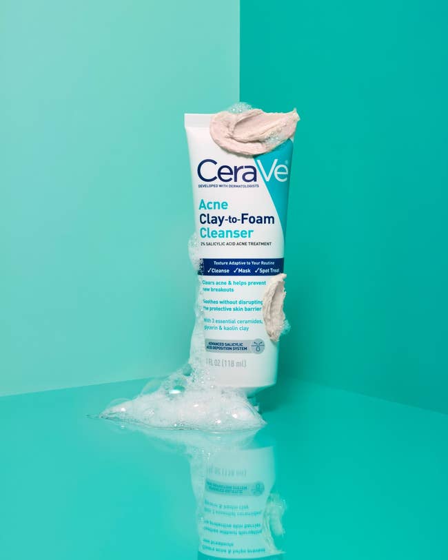 CeraVe Acne Clay-to-Foam Cleanser conduit with foam and clay texture displayed, emphasizing gentle skincare for acne-prone skin