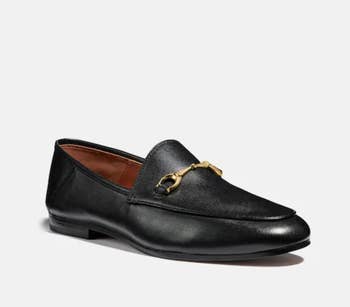 The black loafers with gold buckle