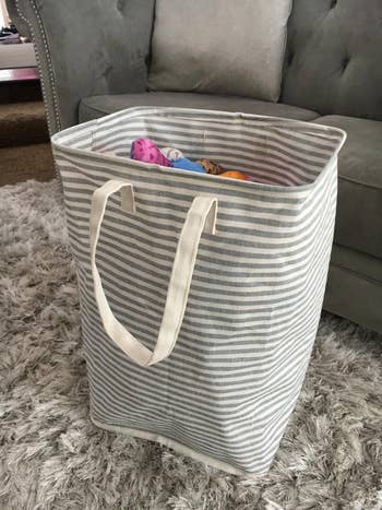 Reviewer image of gray and white striped hamper
