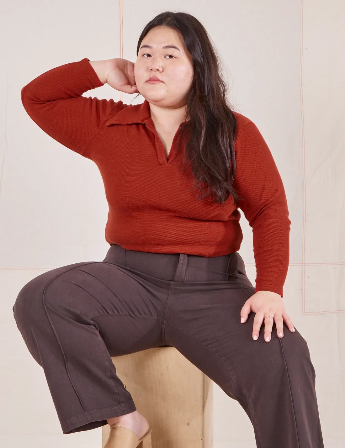 model wearing the long sleeve fisherman polo in paprika