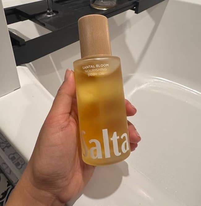 A reviewer holding the Saltair assemblage oil