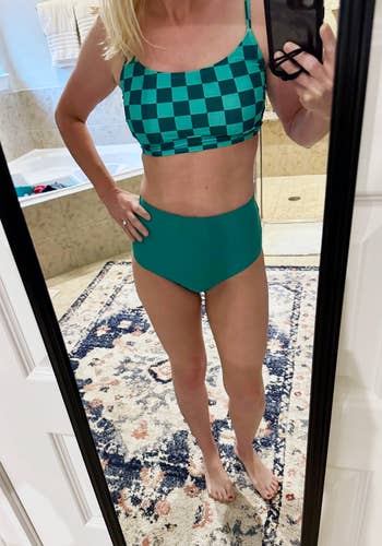 Person successful a checkered swimwear acceptable poses successful a mirror, showcasing a buying prime successful a location setting