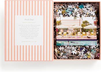 Jigsaw puzzle box with an image of a glamorous poolside setting. Includes text inviting users to experience luxury with themes from Gray Malin