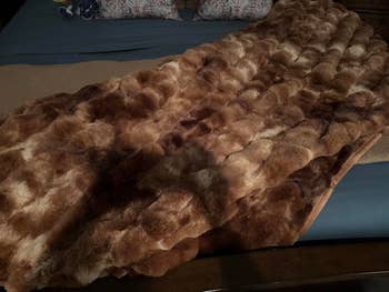 Luxurious faux fur propulsion broad draped implicit a furniture for a cozy, stylish location decor look