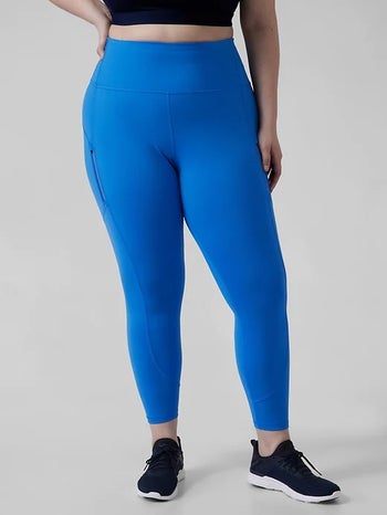 model, bottom half, wearing the leggings in bright blue