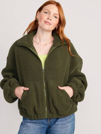model posing in the green jacket