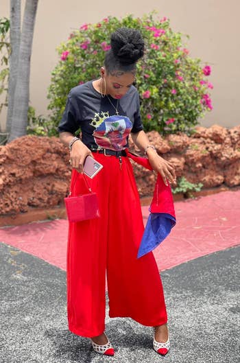reviewer in the red flowy palazzo pants