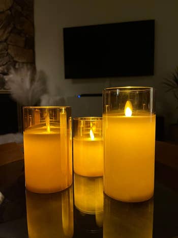 the three candles glowing at night
