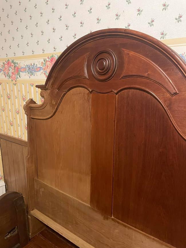 The reviewer with a antique headboard with one half treated with polish and the other half is not