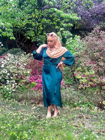 reviewer in teal satin midi dress