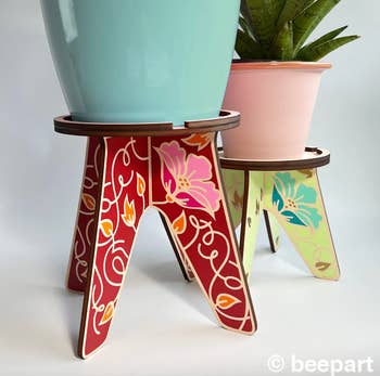 two floral design plant stands