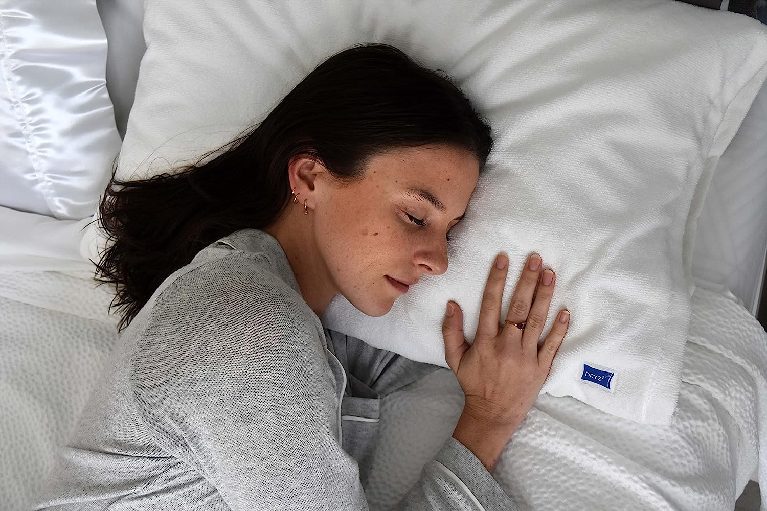 a model sleeping on the towel side