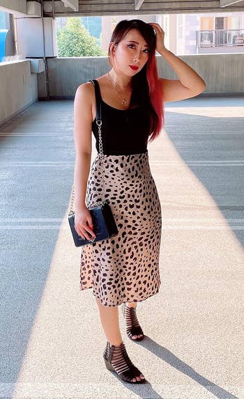 reviewer in the leopard print skirt