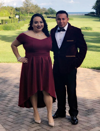 Reviewer wearing the same dress but in a burgundy color