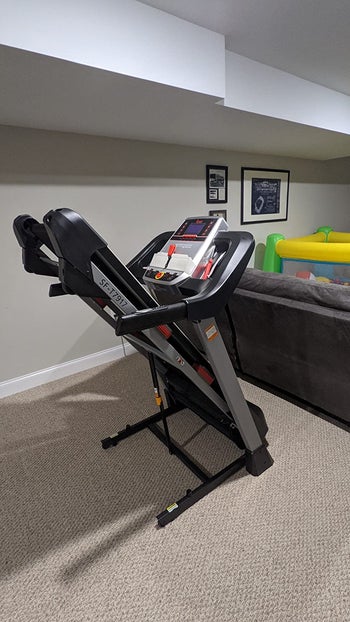 reviewer photo of the treadmill folding up