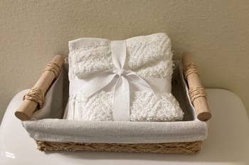 reviewer photo of small towels in wicker basket