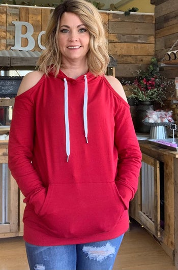 a reviewer wearing the sweatshirt in red