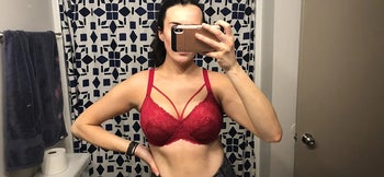 reviewer photo of them wearing a red lacy bra
