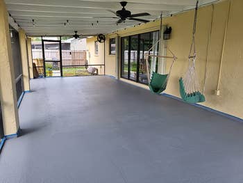 same patio after completely covered with one coat of the paint