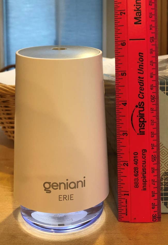 Geniani Erie humidifier stands next to a red ruler showing it’s 6 inches tall