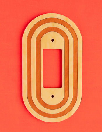 a tan and orange single rocker plate cover