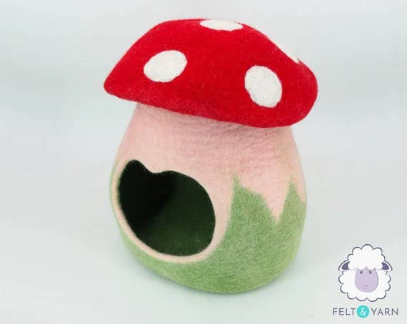 a cute mushroom cat bed with a heart-shaped entry hole