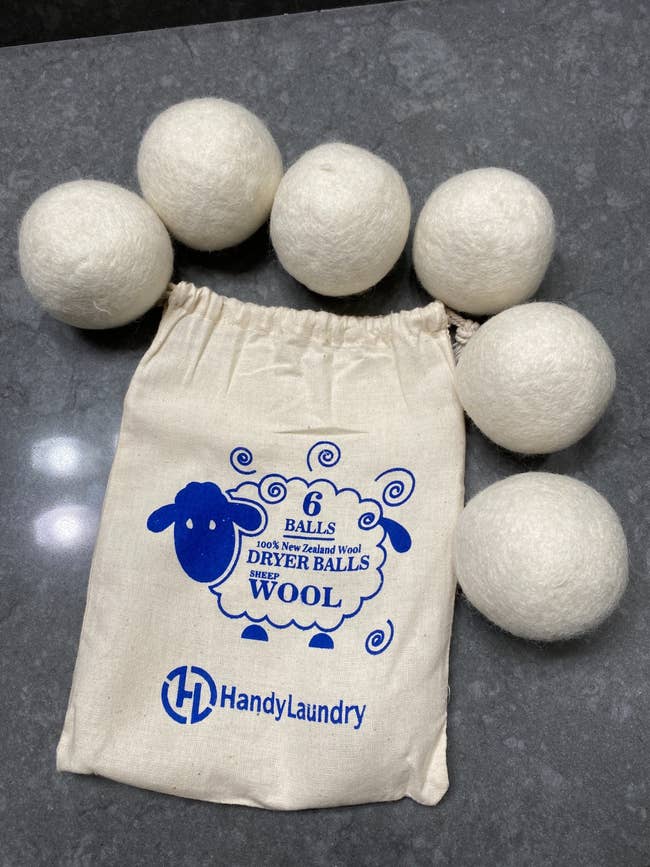a bag with six wool balls around it