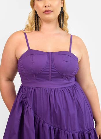 Person wearing the aforesaid  dress, with a adjacent  up   of the sleeveless corset-style bodice