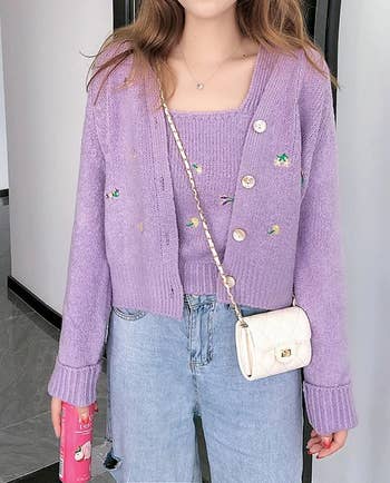 A different model wearing the purple set with jeans