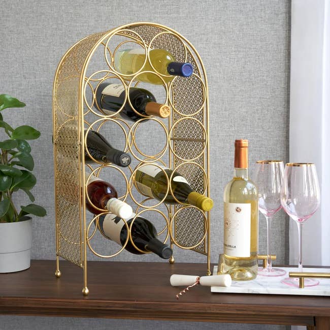 Image of the gold wine rack on a table