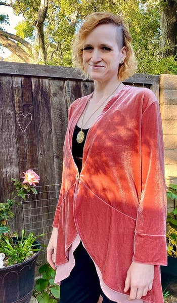 a reviewer wearing the cardigan in peach 