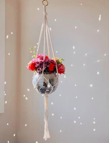 the disco planter hanging with white macrame 