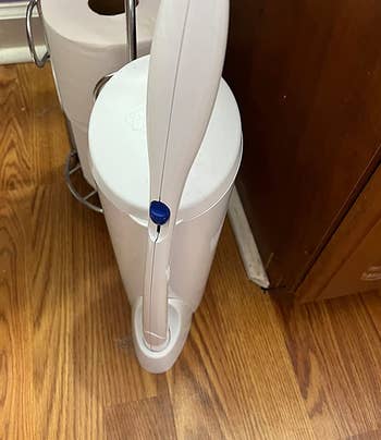 reviewer photo of the toilet wand in its stand