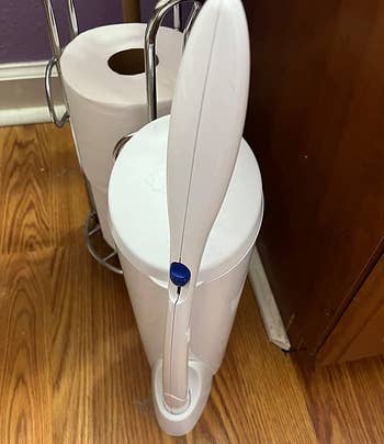 reviewer photo of the toilet wand in its stand