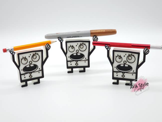 a trio of doodlebob 3d printed pencil holders