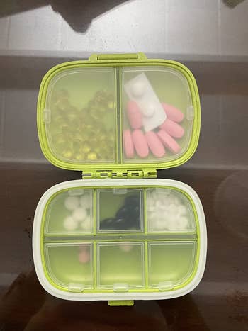 an open pill box showing the compartments