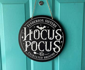 same size sign on reviewer's door that says hocus pocus 
