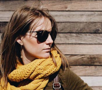 reviewer wearing the mustard yellow scarf