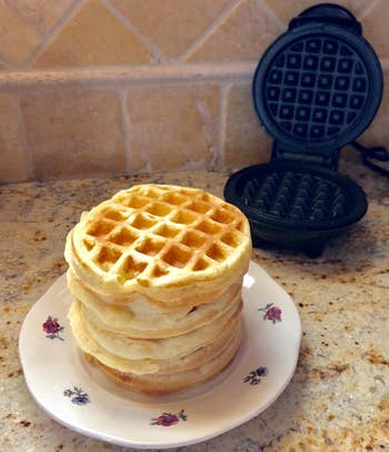 reviewer photo of a stack of waffles made in the mini waffle iron